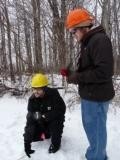 students on a winter field trip wearing hard hats